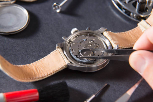 Man replacing a wristwatch battery